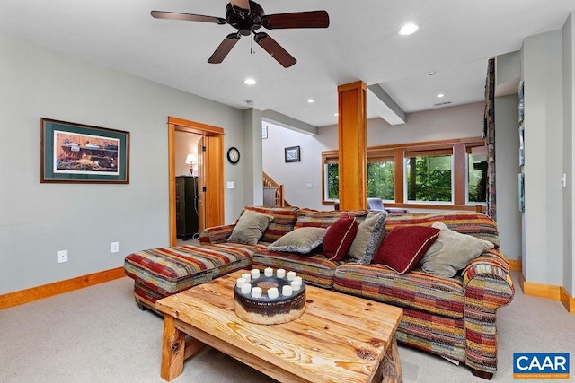 living room with ceiling fan and carpet flooring