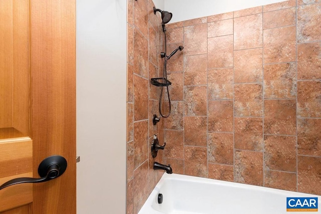 bathroom featuring tiled shower / bath