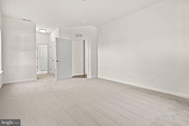 unfurnished bedroom featuring light colored carpet