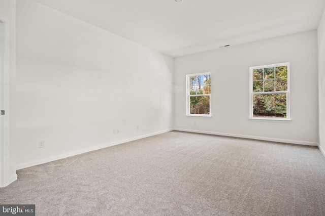 unfurnished room featuring carpet flooring