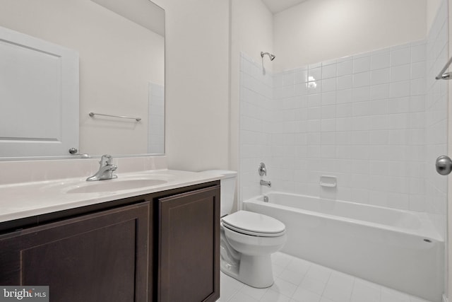 full bathroom featuring tile patterned floors, toilet, vanity, and washtub / shower combination