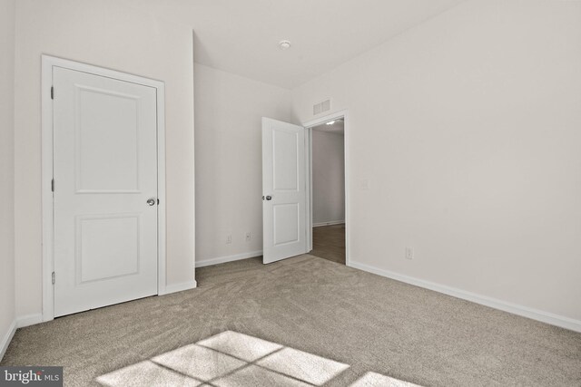 unfurnished bedroom featuring carpet flooring