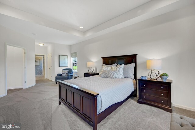 bedroom featuring light carpet