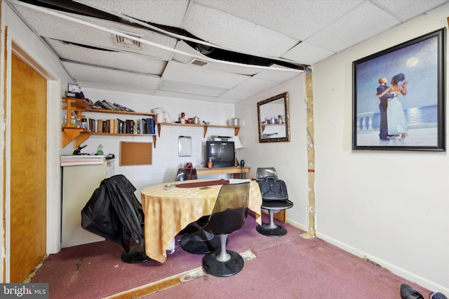 office area featuring carpet and a paneled ceiling