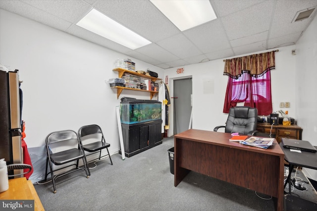 carpeted home office featuring a paneled ceiling