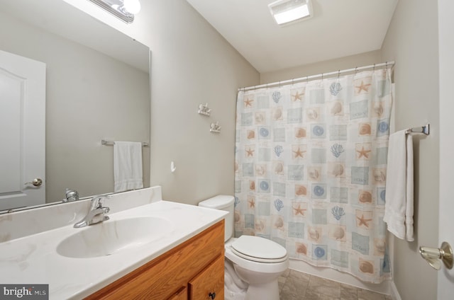 bathroom with vanity, curtained shower, and toilet