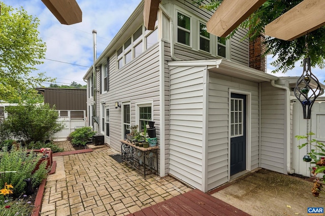 view of side of property with a patio