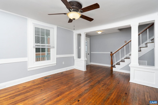 unfurnished room with ceiling fan and dark hardwood / wood-style flooring