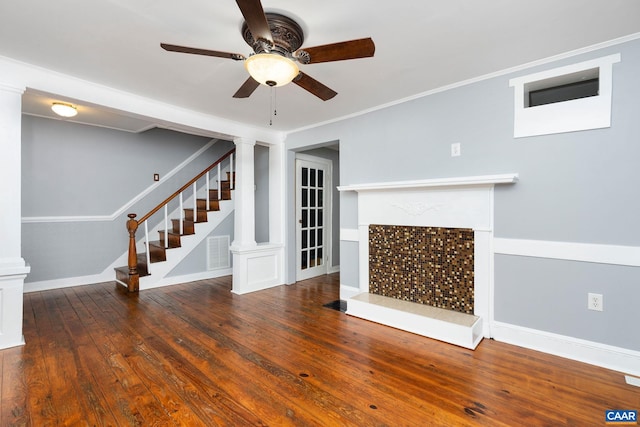 unfurnished living room with ceiling fan, crown molding, and dark wood-type flooring