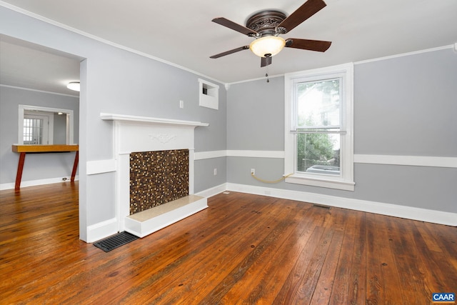 unfurnished living room featuring ceiling fan, crown molding, and hardwood / wood-style flooring