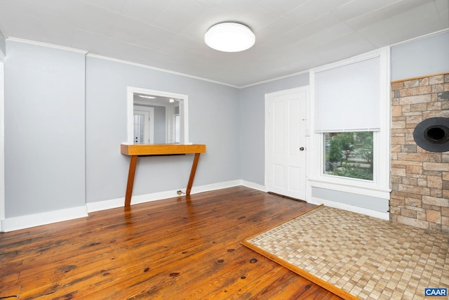 entrance foyer featuring hardwood / wood-style floors and ornamental molding