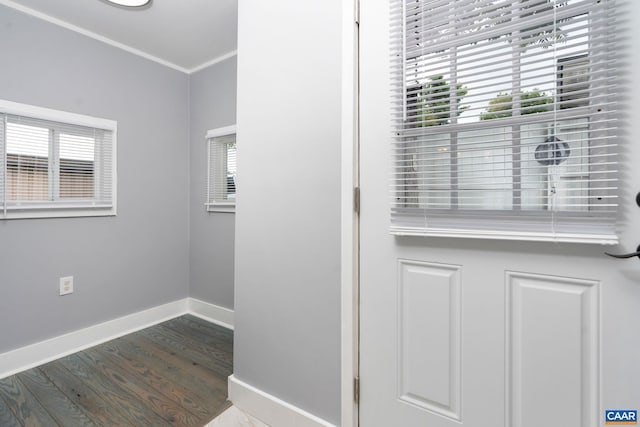 details featuring hardwood / wood-style floors and crown molding