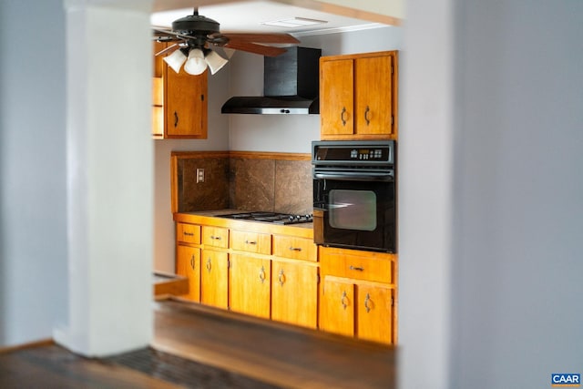 kitchen with gas cooktop, decorative backsplash, ventilation hood, ceiling fan, and oven