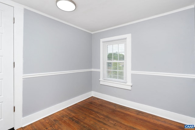 unfurnished room with hardwood / wood-style flooring and ornamental molding