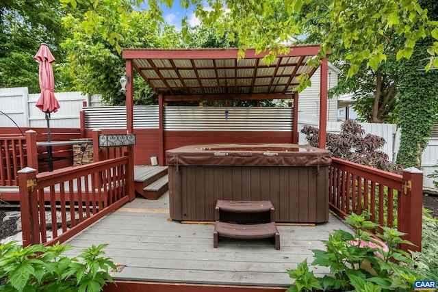 wooden terrace with a hot tub