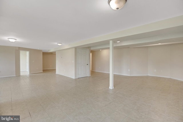 basement featuring light tile patterned flooring