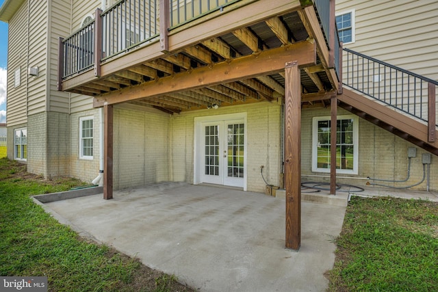 view of patio with french doors and a deck