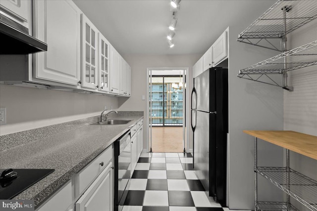 kitchen featuring sink, white cabinets, black appliances, and range hood