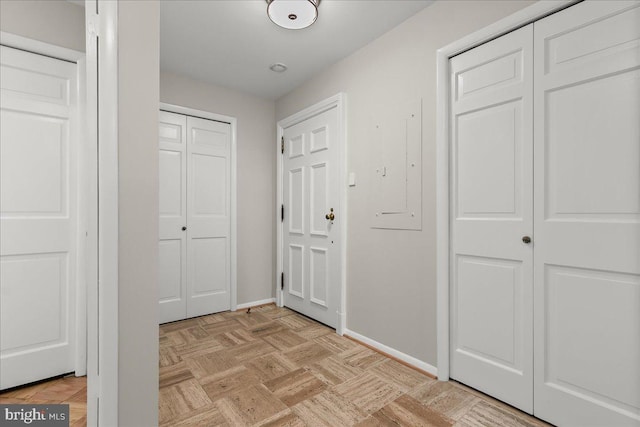 hall featuring light parquet flooring