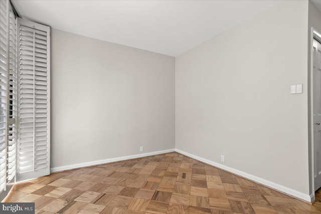 unfurnished bedroom with light parquet flooring