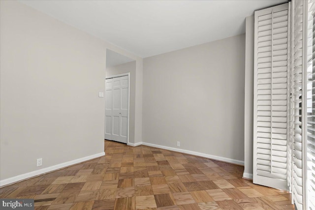 unfurnished bedroom featuring light parquet floors