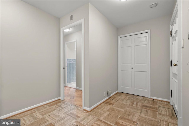 hallway with light parquet floors