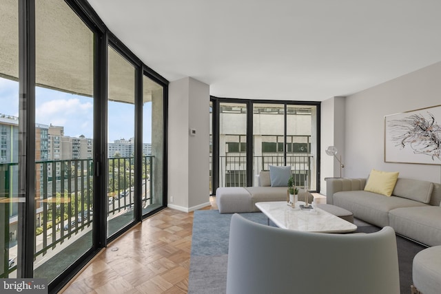 living room featuring light parquet floors and expansive windows