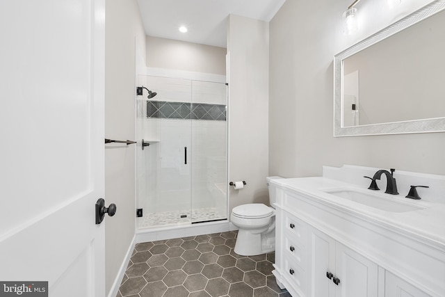 bathroom with a shower with shower door, tile flooring, toilet, and large vanity