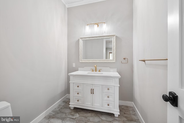 bathroom with tile floors, ornamental molding, toilet, and vanity