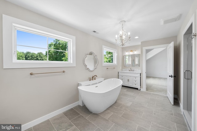 bathroom with a notable chandelier, tile flooring, separate shower and tub, and vanity