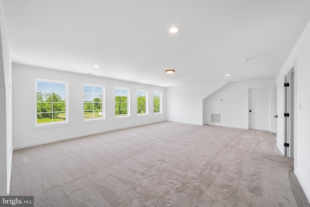 empty room featuring light carpet