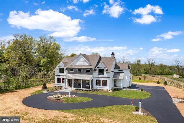 view of front of home with a garage and a front yard