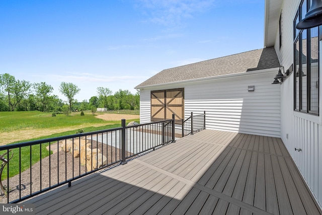 deck featuring a lawn