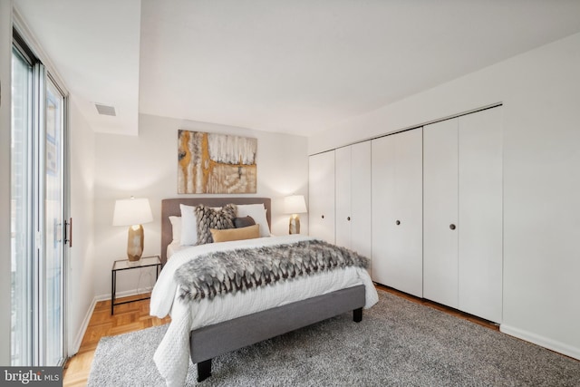 bedroom featuring light parquet floors