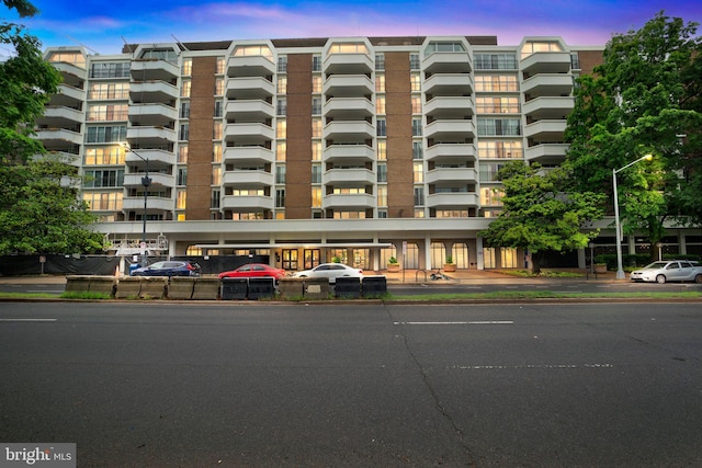 view of outdoor building at dusk