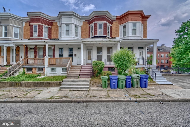 townhome / multi-family property with covered porch