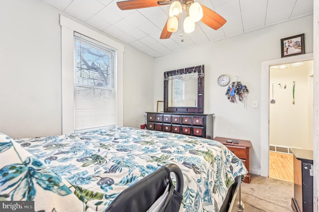 carpeted bedroom with ceiling fan