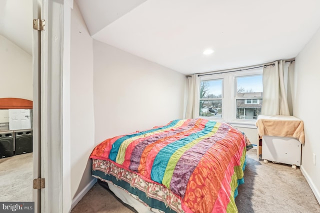 bedroom with carpet floors and lofted ceiling