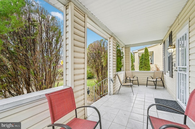 view of patio featuring a porch