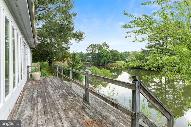 wooden deck featuring a water view