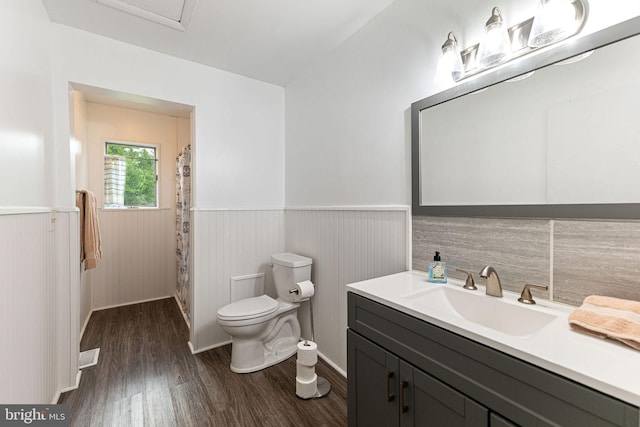 bathroom featuring hardwood / wood-style floors, vanity, and toilet