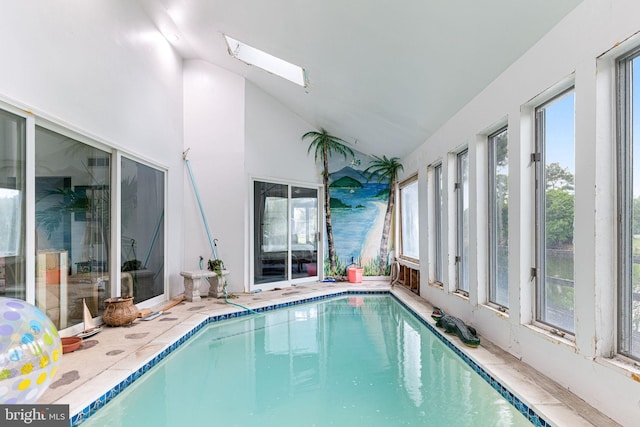 view of pool with a skylight