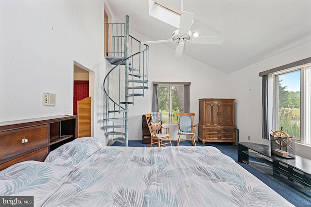 carpeted bedroom with high vaulted ceiling, multiple windows, and ceiling fan