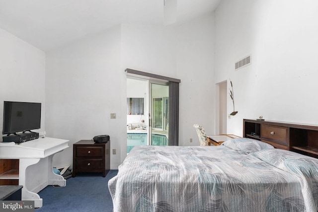 bedroom featuring high vaulted ceiling and carpet