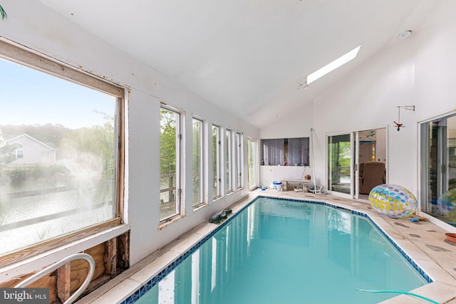 view of swimming pool with a skylight