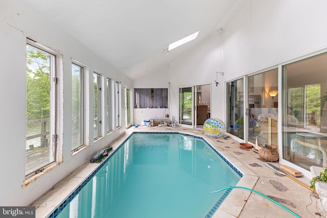 view of pool featuring a skylight