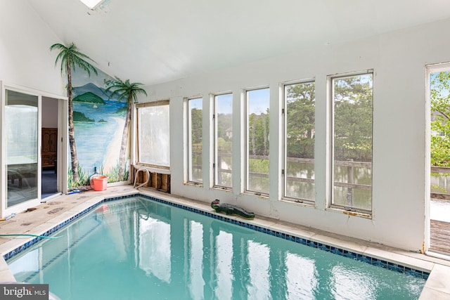 view of swimming pool with a jacuzzi