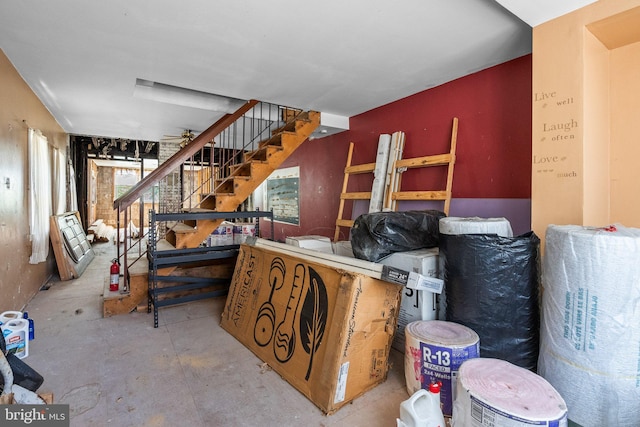 interior space with ceiling fan