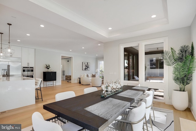 7013 Raleigh Rd, Annandale, VA 22003 - dining area with recessed lighting, light wood finished floors, and a tray ceiling