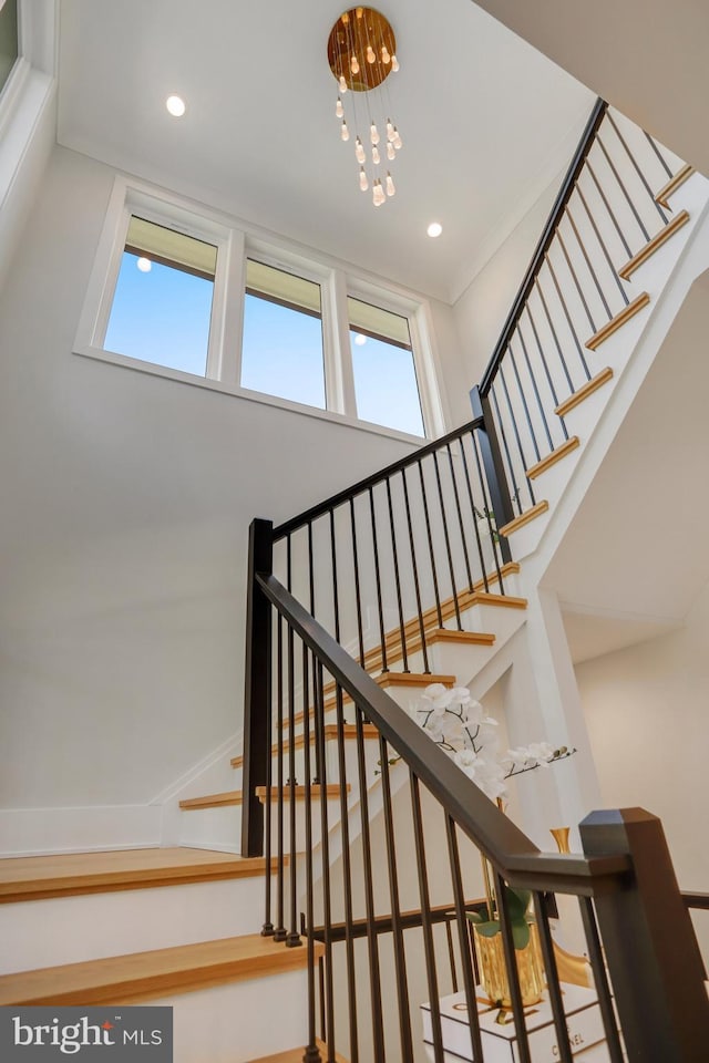 7013 Raleigh Rd, Annandale, VA 22003 - stairway with a chandelier, a wealth of natural light, and recessed lighting